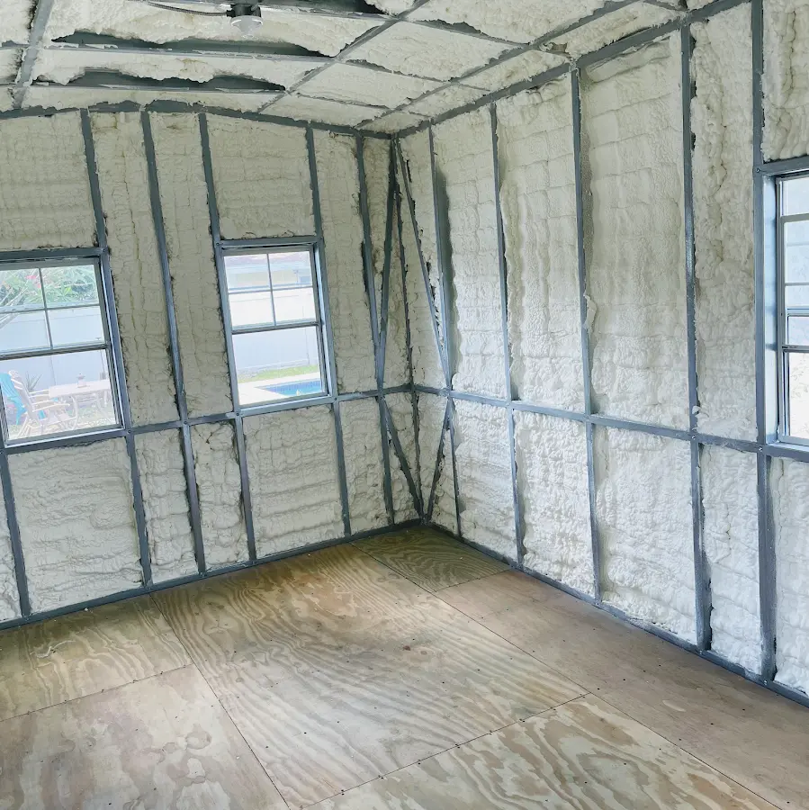 Closed-cell spray foam insulation applied to wall cavities in a residential project in Atlas